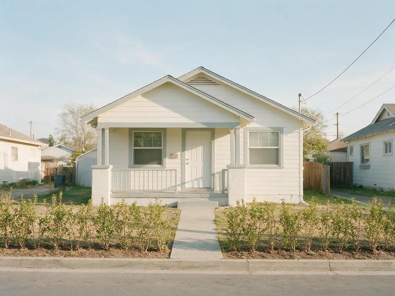 A modest single-story bungalow with a small front porch